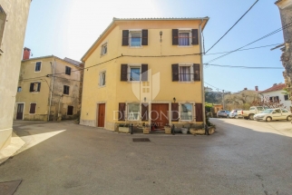 Momjan, a large apartment house with a lot of potential