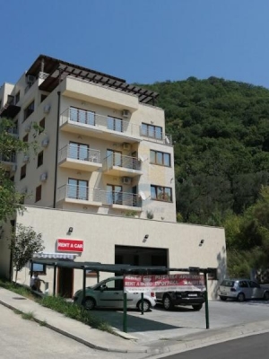A four bedroom apartment for sale in Budva with a sea view
