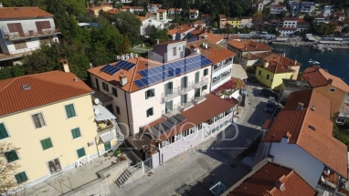 Rabac, residential and commercial building first row to the sea