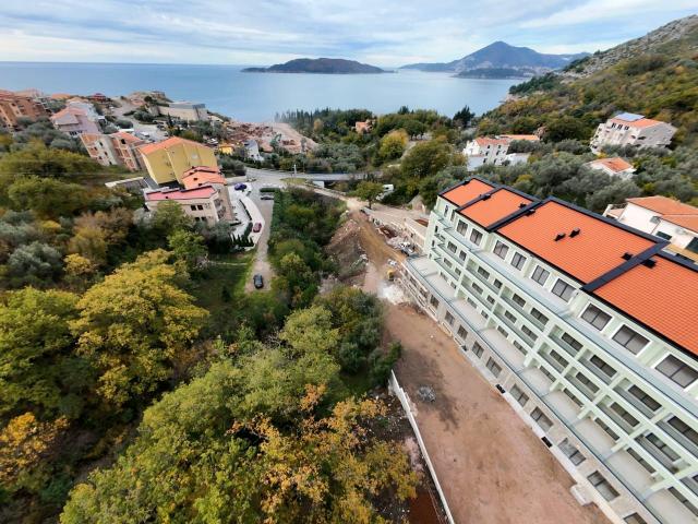 Prodaja dvosobnog stana 108m² u novogradnji sa pogledom na more, parkingom i oslobođenjem od poreza 