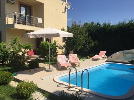 A three-story house with a swimming pool is for sale in Bar, Polje district. 